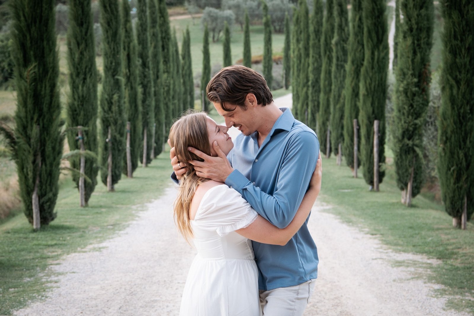 Couple embracing and smiling during engagement photoshoot in Montepulciano Tuscany