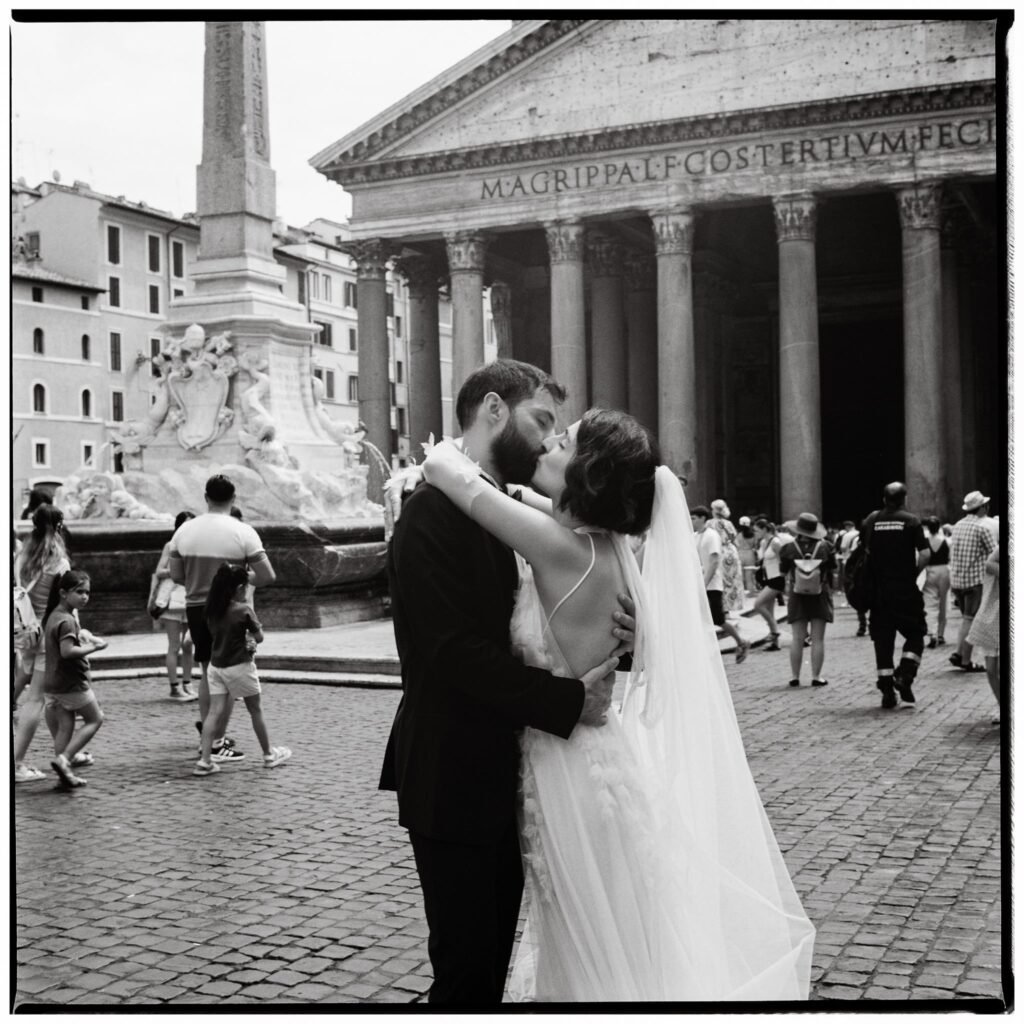 Elopement in Rome Captured on Film Photography 1 Bride and groom kissing in front of the Pantheon during their Rome elopement, photographed on film.