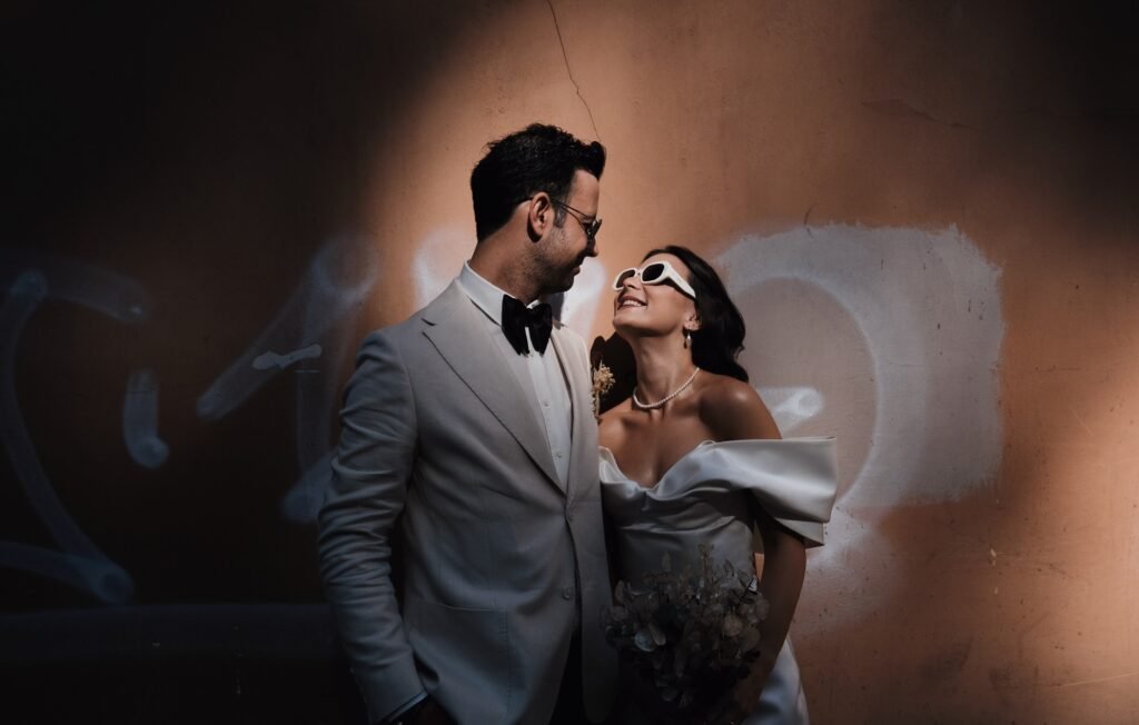 Bride and groom smiling at each other during a candid elopement photoshoot in Rome Italy