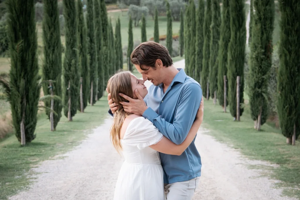 couple photoshoot in Tuscany Val d Orcia cypress road candid natural light couple photographer Tuscany