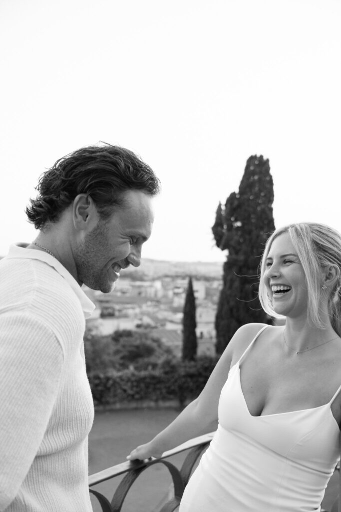 Black and white portrait of Riley and Maddie laughing during their Rome anniversary photoshoot